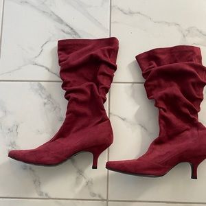 Burgundy heeled boots. Never worn. Size 9.